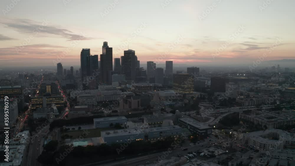 AERIAL: Cinematic View of Busy Downtown Los Angeles right after dusk with Skyline City Lights and Car traffic AERIAL: Cinematic View of Busy Downtown Los Angeles right after dusk with Skyline City Lights and Car traffic