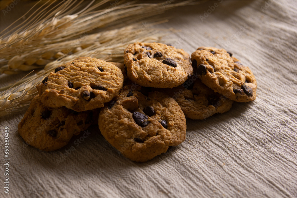 Close-up of chocolate cookies chip on wooden table Close-up of chocolate cookies chip on wooden table