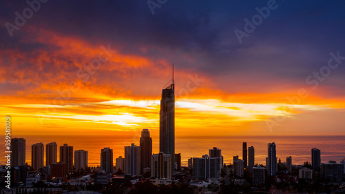 Aerial view over Surfers Paradise apartments and the Q1 building with a firey sunrise sky