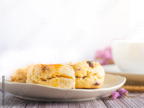 Traditional British scones with a tea cup and blurred background