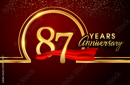 87th anniversary logo with confetti and golden ring, red ribbon isolated on red background, vector design for greeting card and invitation card. photo