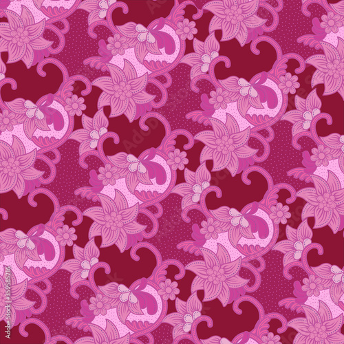 Traditional floral pattern batik drawing with dots and curly lines in pink tones. Batik is an Indonesian technique of wax-resist dyeing applied to whole cloth.