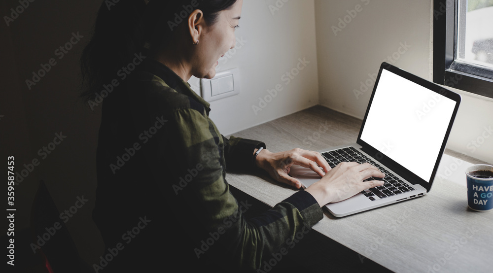computer mockup image blank screen.hand woman work using laptop with white background for advertising,contact business search information on desk at coffee shop.marketing and creative design computer mockup image blank screen.hand woman work using laptop with white background for advertising,contact business search information on desk at coffee shop.marketing and creative design