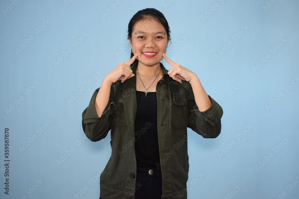 Portrait of Indonesian Woman Using Black shirt and jacket with isolated background Portrait of Indonesian Woman Using Black shirt and jacket with isolated background