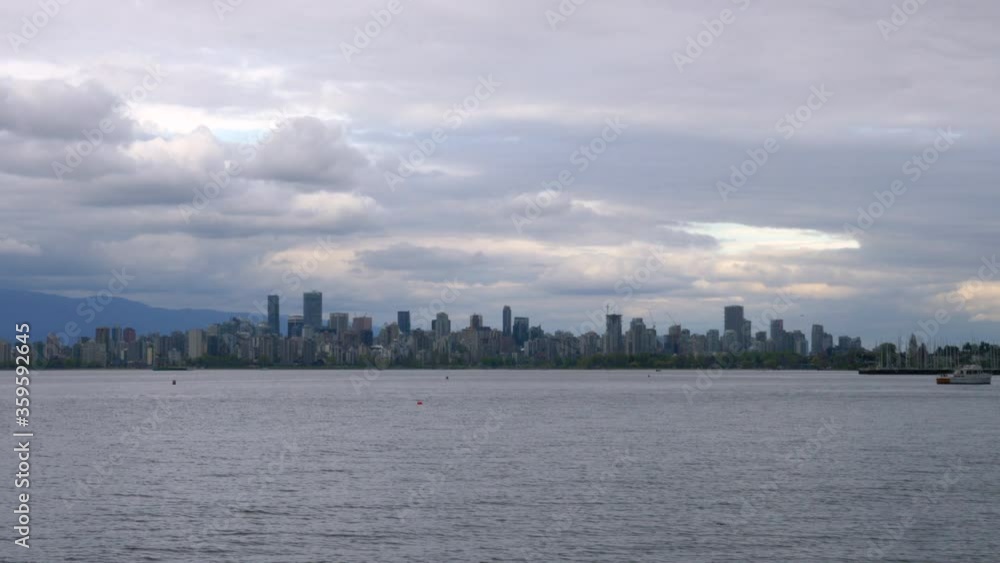 Calm Ocean With Downtown Skyline And Vancouver Harbour On The Background, View From Burnaby, BC, Canada On A Cloudy Day. - timelapse Calm Ocean With Downtown Skyline And Vancouver Harbour On The Background, View From Burnaby, BC, Canada On A Cloudy Day. - timelapse