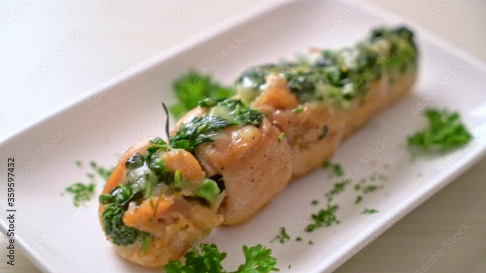 Chicken breasts stuffed with spinach and cheese on plate Chicken breasts stuffed with spinach and cheese on plate