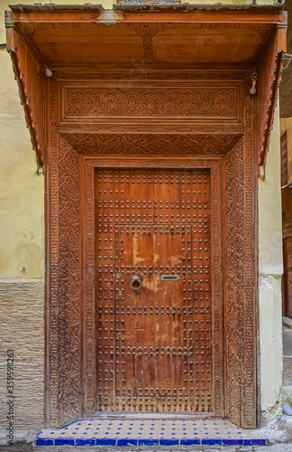 Old door of a traditional Moroccan house in Fes
