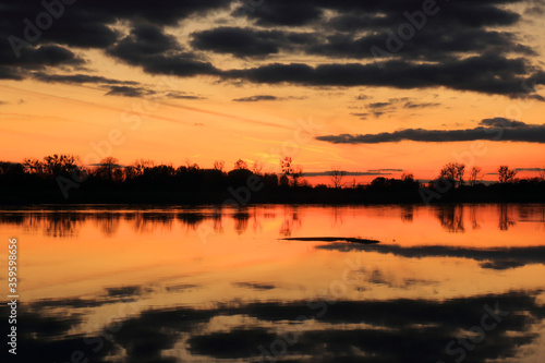 Colorful sunset by the Odra River, Poland. © Dariusz