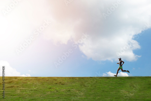 one man running on hill with cloud and blue sky background
