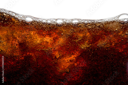 Cola soda bubble foam with ice in glass cold drink beverage background