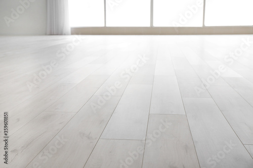 View of clean laminate floor in empty room