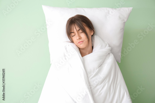 Tired woman with bedding on...