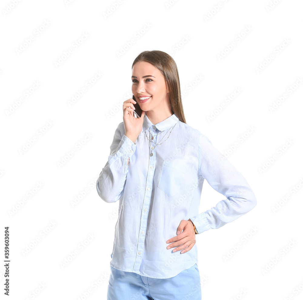 Beautiful young woman in stylish shirt talking by phone on white background Beautiful young woman in stylish shirt talking by phone on white background