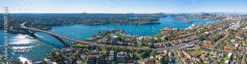 Aerial view of the Gladesville bridge, Parramatta river and the Sydney suburb of drummoyne looking east towards the city.