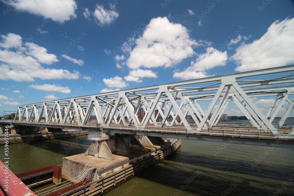 Fototapeta premium Spoorbrug bridge Dordrecht and road bridge Zwijndrechtse brug in the Netherlands over the Merwede.