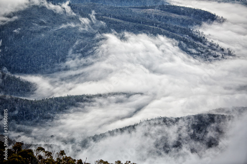Low cloud and fog hugging the valleys and hilltops on a cold winter day in Hobart Tasmania