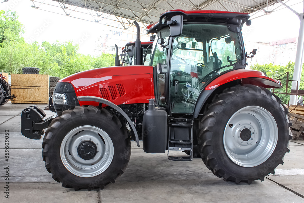 Obraz premium The colorful tractors in the road