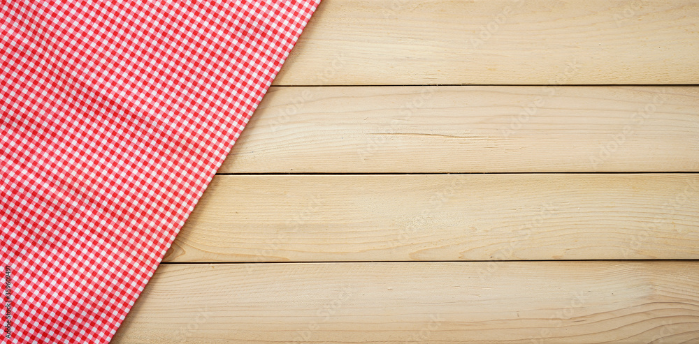 Classic pink tablecloth on wood plank with copy space Classic pink tablecloth on wood plank with copy space