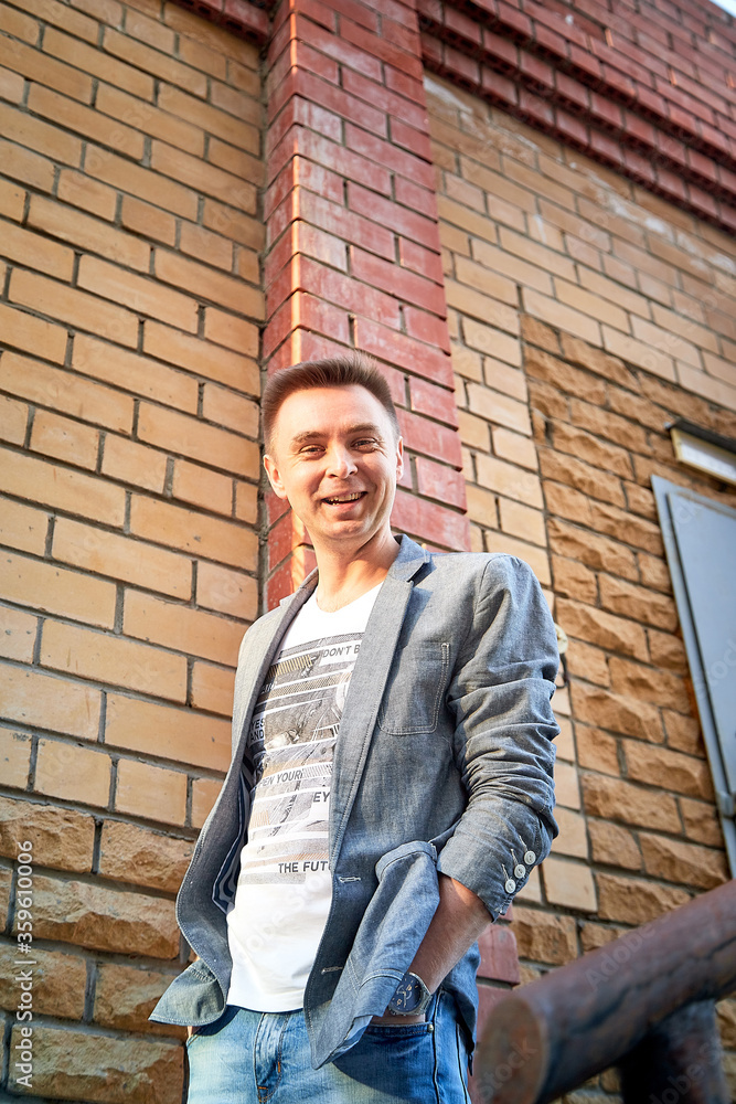 Kirov, Russia - September 04, 2019: Portrait of a handsome fun man outdoors in the city Kirov, Russia - September 04, 2019: Portrait of a handsome fun man outdoors in the city