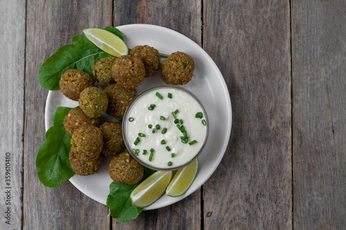 Chickpea falafel balls with sauce and tomatoes