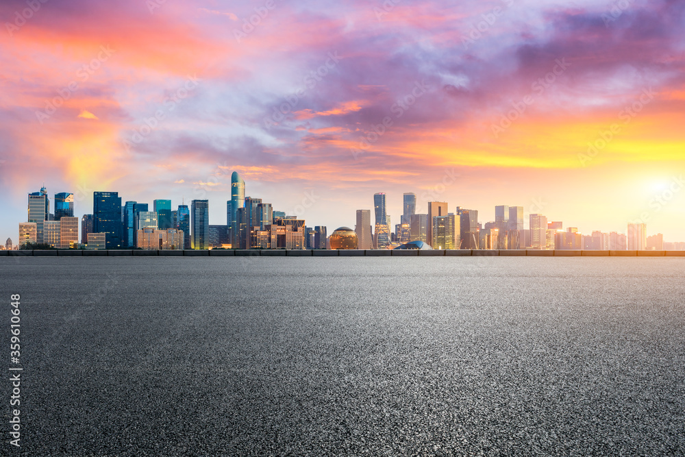 Hangzhou city skyline and buildings with asphalt road at sunrise,China.