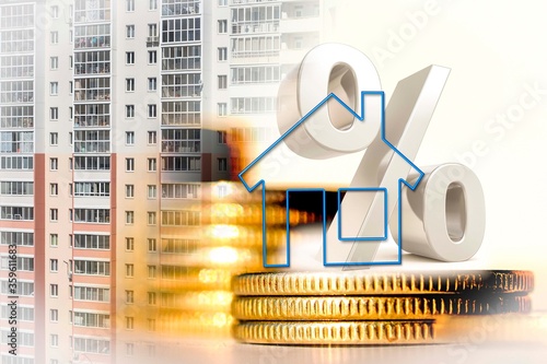 The percent symbol and real estate  on a background of money . The concept of price changes on the real estate market .