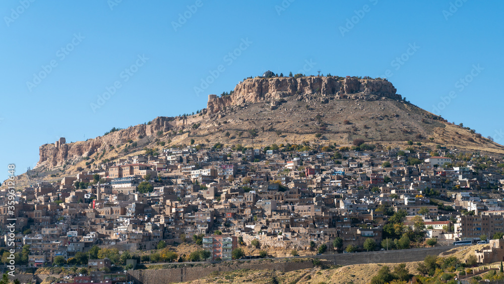 Town of Savur skyline with old stone houses on a hill, Mardin, Turkey.