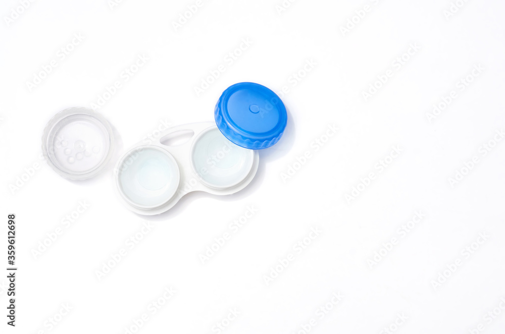 lenses in a container on a white background isolated lenses in a container on a white background isolated