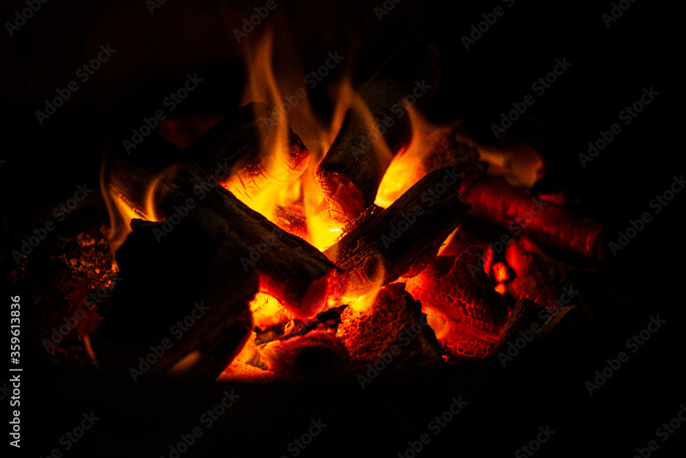 Fototapeta premium Empty Charcoal grill with open fire light at night