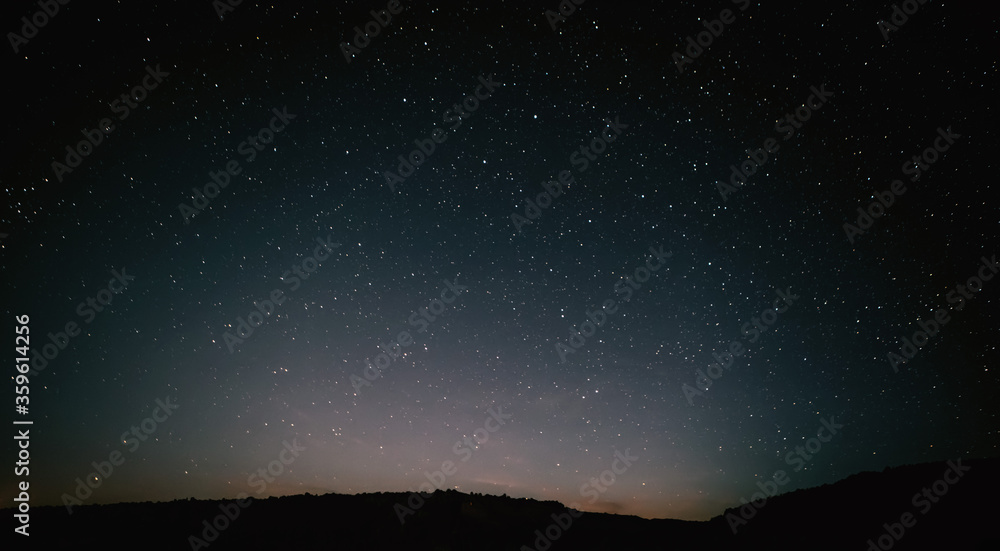 moon against a bright night starry sky reflected in the sea moon against a bright night starry sky reflected in the sea