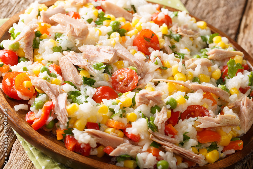 Summer appetizer salad of rice, tuna and fresh vegetables close-up in a plate. horizontal Summer appetizer salad of rice, tuna and fresh vegetables close-up in a plate. horizontal