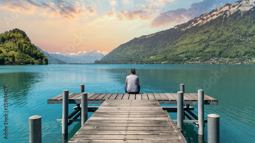 Fototapeta Naklejka Na Ścianę i Meble -  The Pier into the lake Brienzersee in village of Iseltwald Switzerland