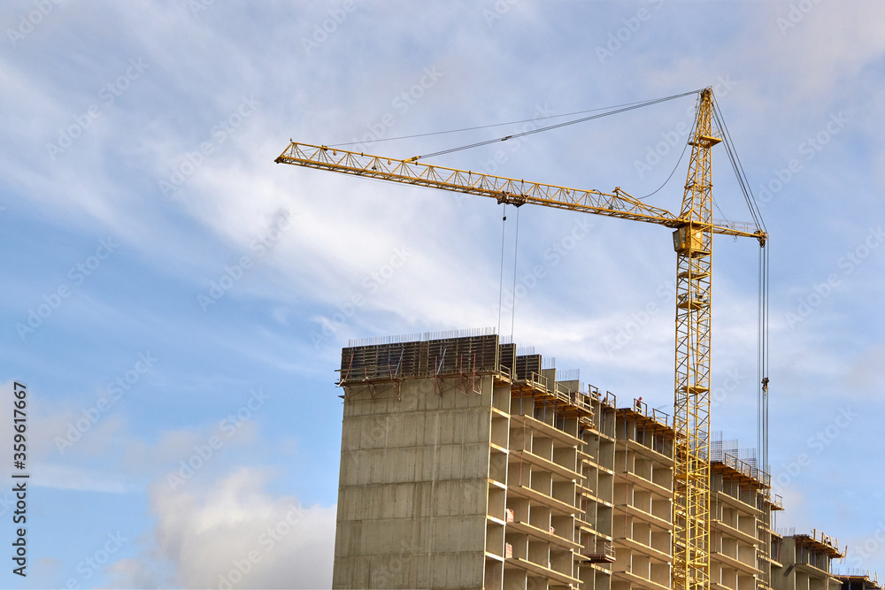 Industrial construction cranes the construction of an building Industrial construction cranes the construction of an building