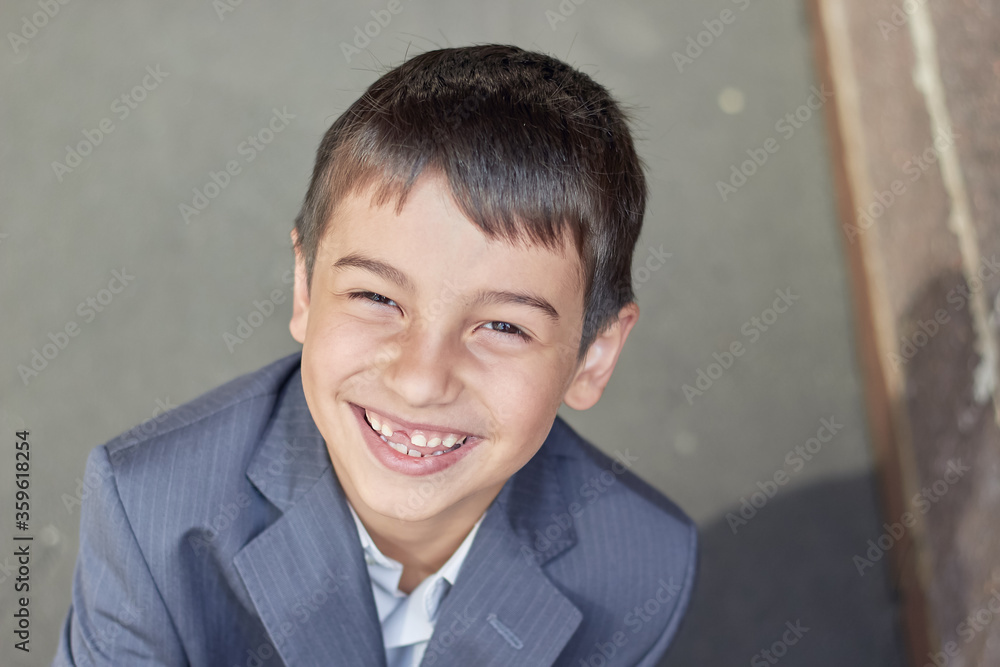 back to school portrait of a young boy with a backpack and a business suit back to school portrait of a young boy with a backpack and a business suit