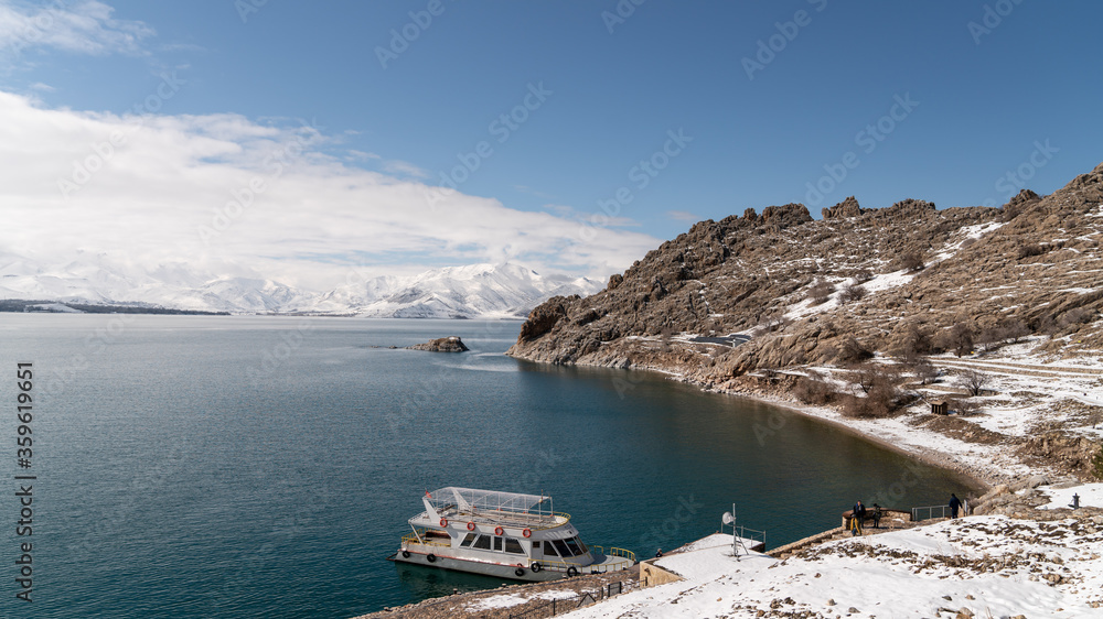 Tour boat in harbour of Akdamar island with lake of Van landscape, Van, Turkey