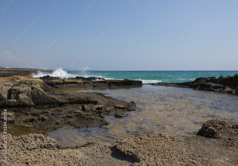 Natural pool on a rock near the sea beach Natural pool on a rock near the sea beach