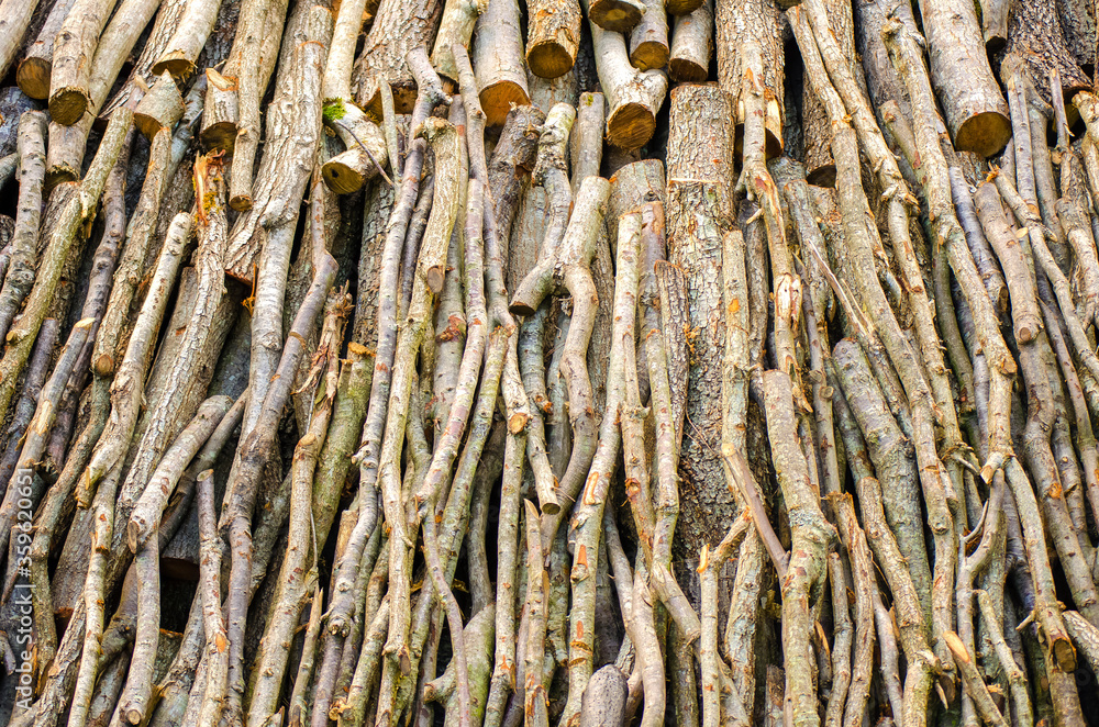 Chopped wood for the fireplace close-up. Wooden logs. Autumn natural background. Copy space. Selective focus image. Chopped wood for the fireplace close-up. Wooden logs. Autumn natural background. Copy space. Selective focus image.