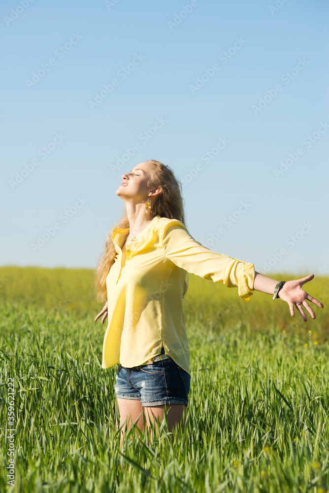 portrait of young blond hair woman who feels inspiration and freedom in summer green wheat field portrait of young blond hair woman who feels inspiration and freedom in summer green wheat field