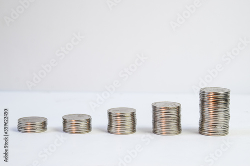 One Thousand Rupiah Coin Stack And Growth With White Background