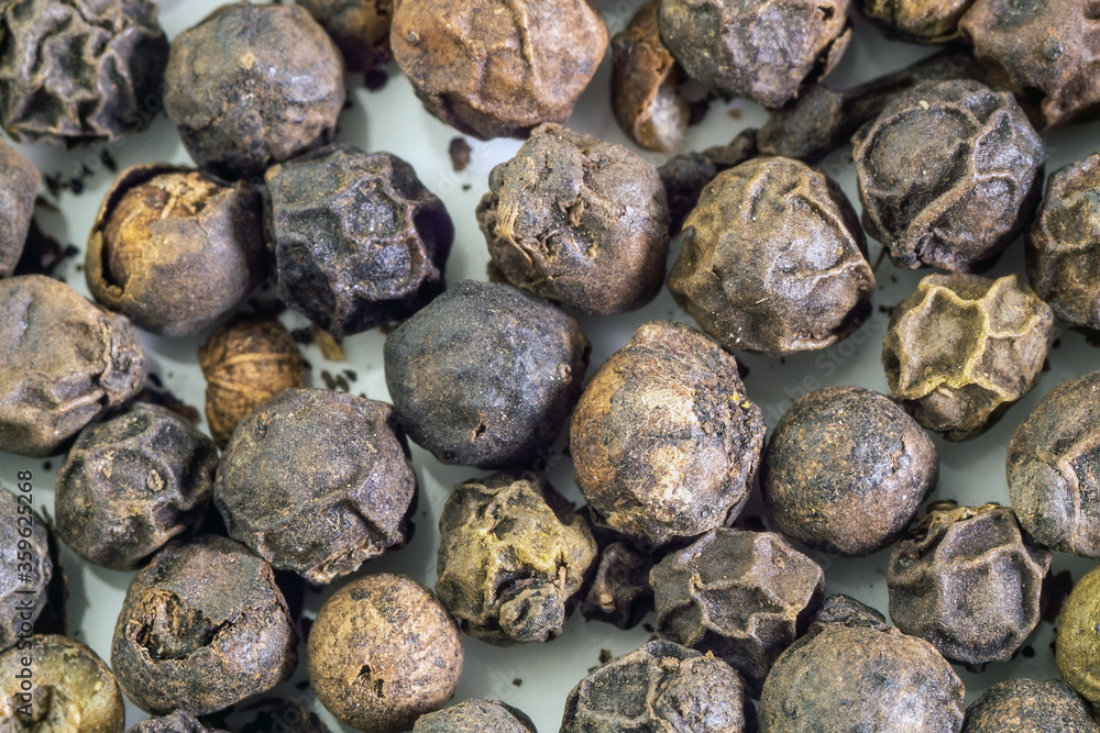 Black pepper corns close-up macro background, texture Black pepper corns close-up macro background, texture