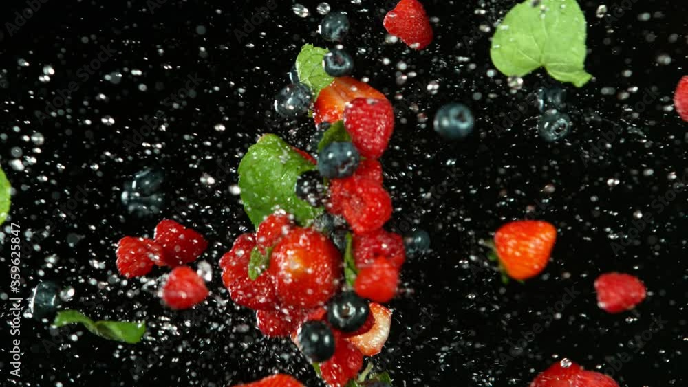 Super slow motion of berries fruit flying up in the air with water splashes. Filmed on high speed cinema camera, 1000 fps. Super slow motion of berries fruit flying up in the air with water splashes. Filmed on high speed cinema camera, 1000 fps.