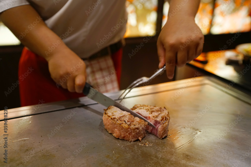 Dry Aging steak with Koji Rice - Grilled beef on teppanyaki grill plate, Prepared for Teppanyaki style, Enjoy the spectacle of cooked to perfection by chef, Traditional Japenese steakhouse.