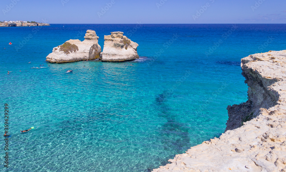Fototapeta premium The most beautiful coast of Apulia: Torre Dell'Orso Bay, ITALY (Lecce).Typical seascape of Salento: view of the two stacks called The Two Sisters.