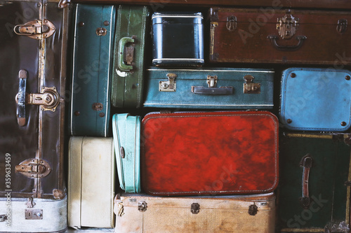 many different colorful and old suitcase.Travel concept