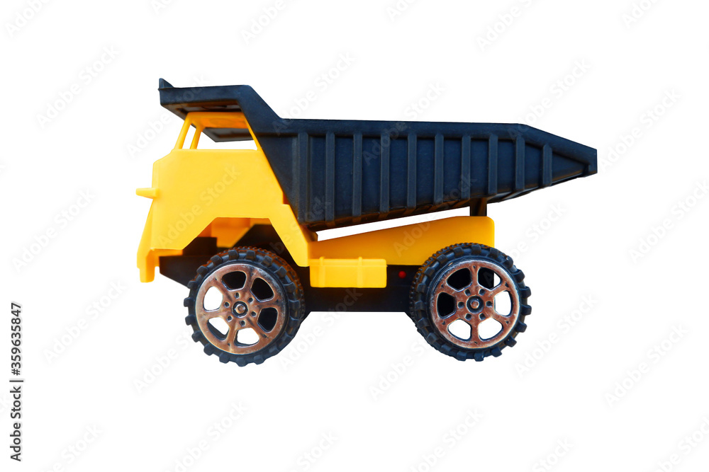 Tipper truck toy is made from plastic isolated on white background Tipper truck toy is made from plastic isolated on white background
