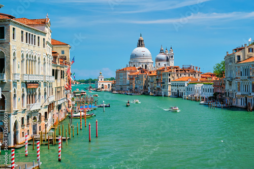 View of Venice Grand Canal with boats and Santa Maria della Salute church in the day from Ponte dell'Accademia bridge. Venice, Italy © Dmitry Rukhlenko
