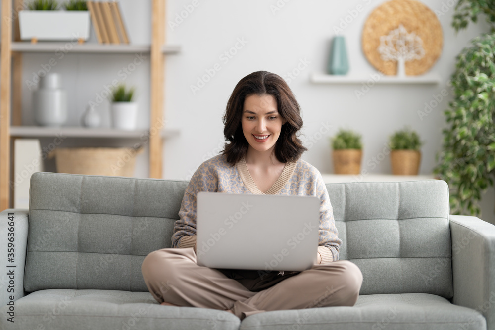 woman working on a laptop at home. woman working on a laptop at home.