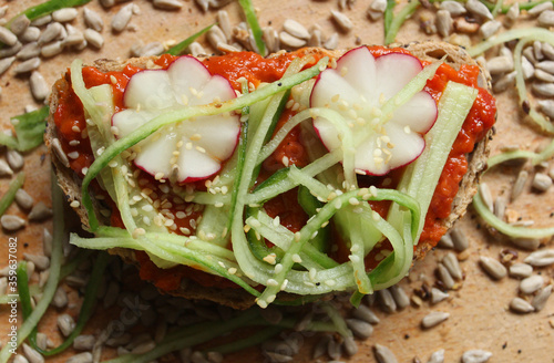 A sandwich with vegetables and seeds, close up 