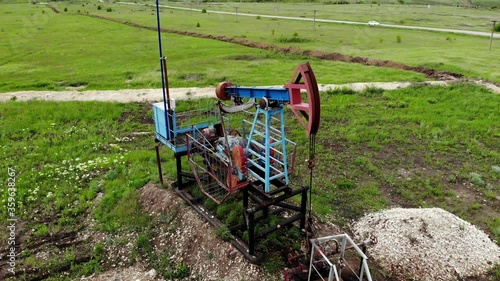 Oil pump jack rocking. Rocking machines for power generation. Extraction of oil. Aerial view.