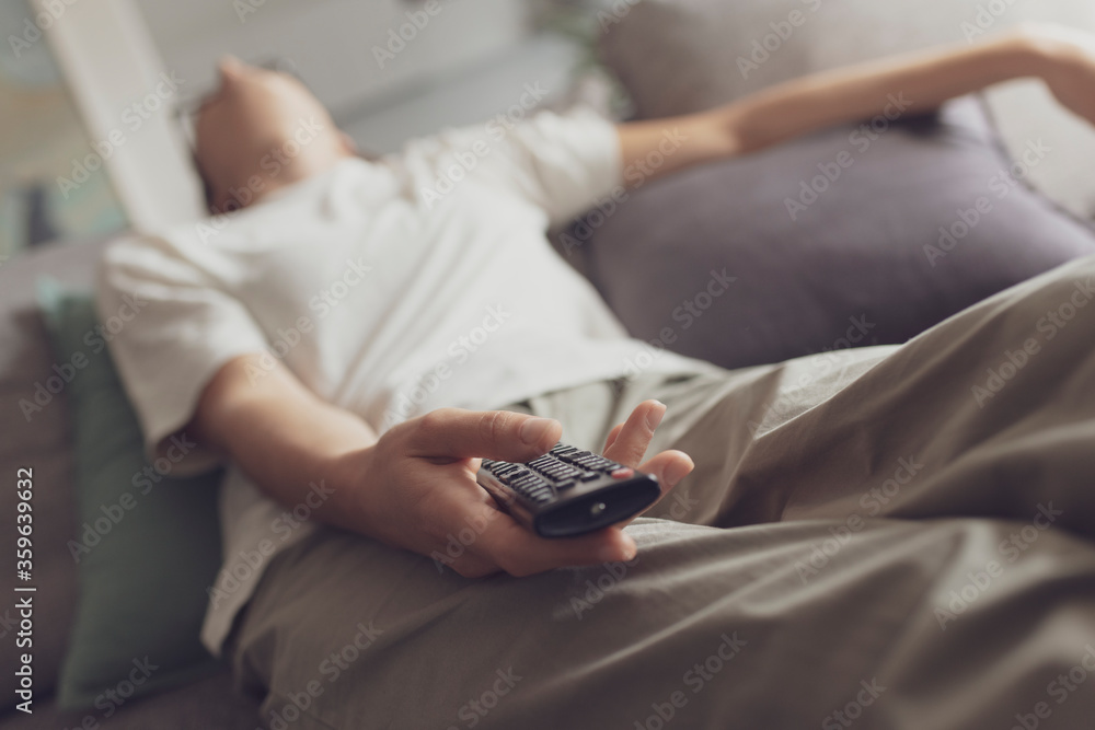 Bored woman watching television at home Bored woman watching television at home